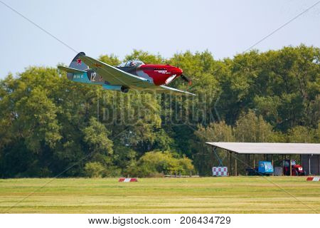 PRAGUE, CZECH REPUBLIC - 9.09.2017: Propeller military plane yak parking at the airport in sunny day, Prague, Czech Republic