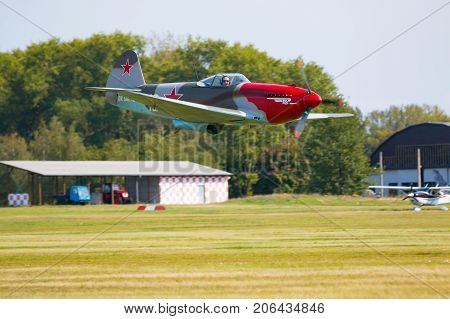 PRAGUE, CZECH REPUBLIC - 9.09.2017: Propeller military plane yak parking at the airport in sunny day, Prague, Czech Republic