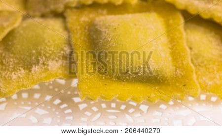 Raw handmade agnolotti, type of ravioli, typical Italian egg pasta from Piedmont, Italy