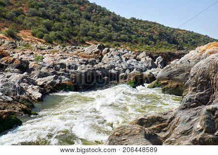 Pulo do Lobo or wolf's leap waterfall and cascade on river Guadiana in vicinity of Mertola Alentejo Portugal