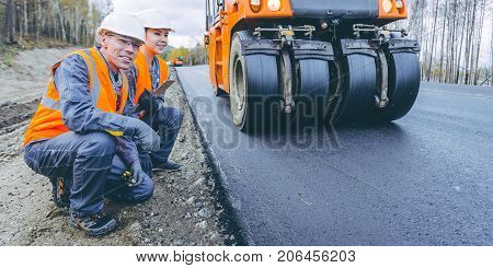roller road repair work pavement ashalt happy