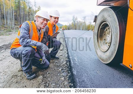 roller road repair work pavement ashalt happy