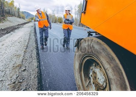 roller road repair work pavement ashalt happy