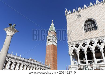 Piazza San Marco with Doge's Palace; St Mark's Campanile and Column of San Marco Venice Italy. St. Mark's Square is the most visited tourist destination in Venice