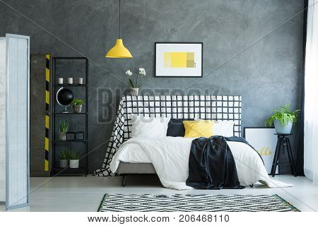 Bed Against Dark Textured Wall