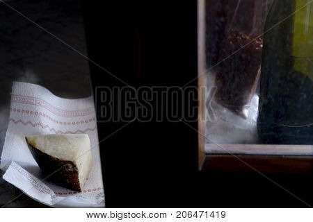 sardinian pecorino illumined from light of a window