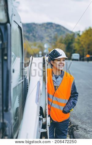 female worker road construction infrastructure repair pavement