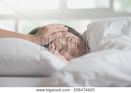 Cute Asian Child Sleeping On White Bed With Mother Care
