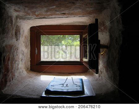 Small Window of old farm house near forest