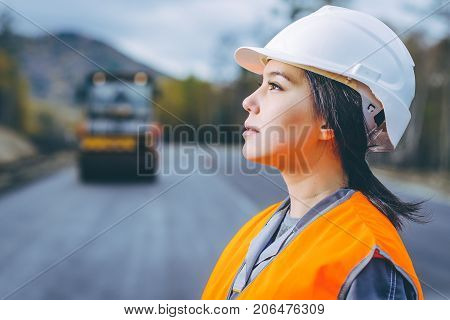 female worker road construction infrastructure repair pavement