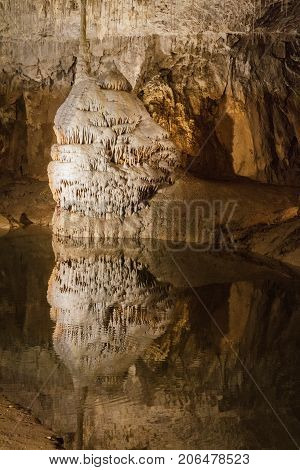 Huge cave with water reflection in france