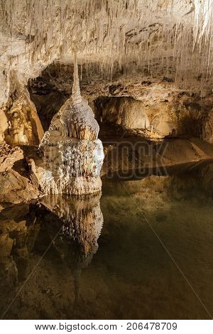Huge cave with water reflection in france