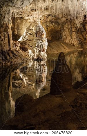 Huge cave with water reflection in france