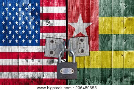 US and Togo flag on door with padlock