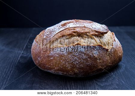 Ball of Bread on wood dark and dark background