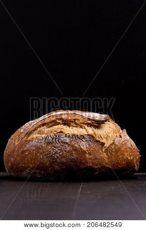 Ball of Bread on wood dark and dark background