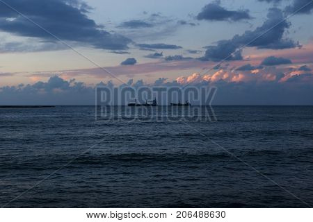 Sunset at the seacoast with purple clouds of Sidon, Saida, Lebanon