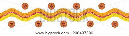 Stock illustration of flower rangoli or border pattern for Diwali or pongal made using marigold or zendu flowers and red rose petals over white background with diwali diya in the middle