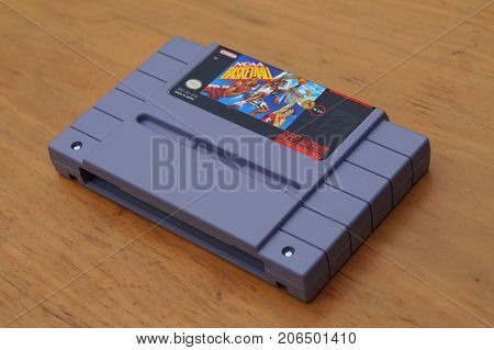 Almere, The Netherlands - September 29, 2017: Super Nintendo Entertainment System (SNES) game cartridge of NCAA Basketball.