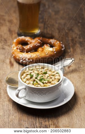portion of bavarian bratnockerl soup on wood