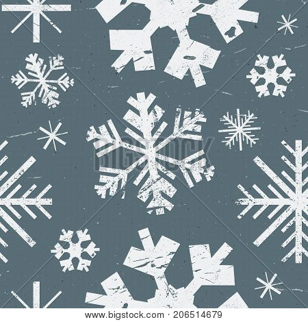 Vector seamless pattern with different graphic showflakes. Abstract winter background. White grunge texture snow on blue background.
