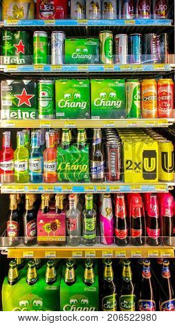 BANGKOK THAILAND - AUGUST 08: Local convenient store 7-Eleven fully stocks carbonated alcoholic beverages in the refrigerator on August 08 2017 in Bangkok.