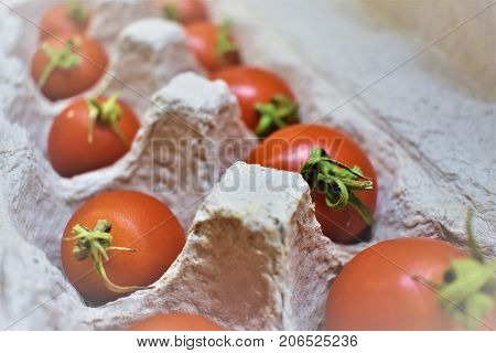 Delicious red tomatoes. A pile of tomatoes. Summer tray market agriculture farm full of organic tomatoes. Fresh tomatoes.