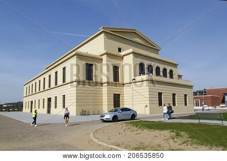 Swansea, UK: May 5 2016: Swansea Bay Campus is located right on the beach on the eastern approach to Swansea. Students walk towards the beach past the The Great Hall where one day they will graduate.
