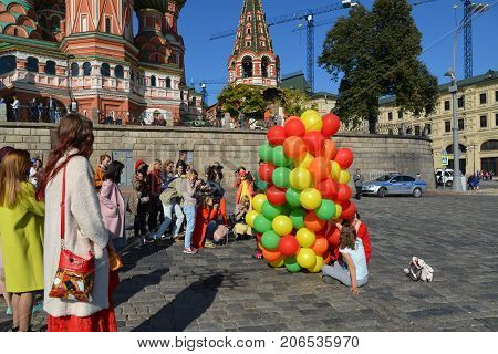 Moscow, Russia - September 23. 2017. Young girls with a balloons on Vasilyevsky spusk