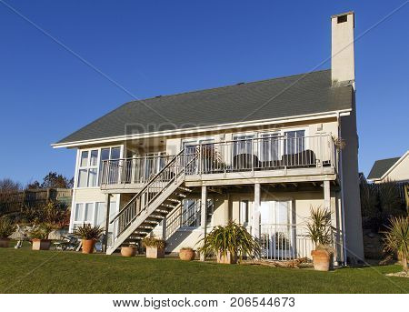 Swansea, UK: March 31, 2016: A large individually designed five bedroom family house with balcony. Prices of desirable detached houses in prime locations have escalated enormously in the last decade.
