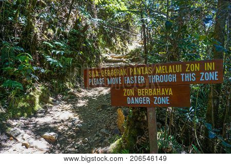 Ranau Sabah Borneo-March 12,2016:National park sign:Danger Zone at Timpohon trail to Laban Rata of Mountain Kinabalu,Sabah.Climbing season officially start on Dec 1,2015 after closure due to earthquake on June 2015.