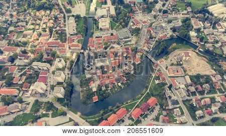 Top view of a river bend running through town. Kocevje, Slovenia.