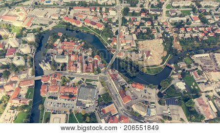 Top view of a river bend running through town. Kocevje, Slovenia.