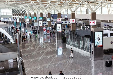 CALGARY CANADA - AUGUST 30 2017: Passengers at the international terminal of Calgary International Airport. Opened in 1938 the airport offers non-stop flights to major cities in North America Europe and East Asia.