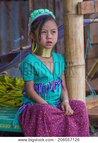 KAYAN STATE MYANMAR - SEP 09 : Portrait of Kayan tribe girl in Kayan state Myanmar on September 09 2017 Kayan tribe woman are well known for wearing neck rings.