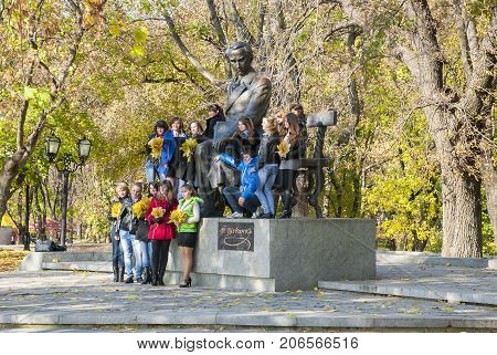 Chernigov,Ukraine, October 19, 2011:Young people photographed near the unique monument to the Ukrainian poet Taras Shevchenko at the young age, Chernigov, Ukraine