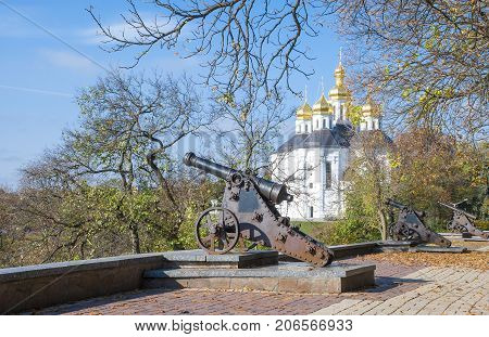 Chernigov,Ukraine, October 19, 2011: Ancient cannons and a church on the rampart of the city of Chernigov, Ukraine