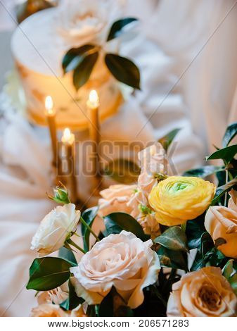 Frowers, candles and wedding painted cake. Still life