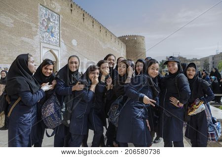 Fars Province Shiraz Iran - 19 april 2017: Iranian schoolgirls are having fun and posing at the sight of a tourist's camera.