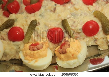 Olivier scrimp salad with pickles tomatoes and eggs