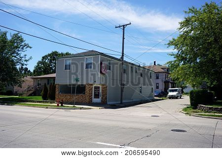 JOLIET, ILLINOIS / UNITED STATES - JULY 25, 2017: One may have one's hair cut and styled at Ken's Doll House Beauty Bar, at the corner of Broadway and Moran Streets.
