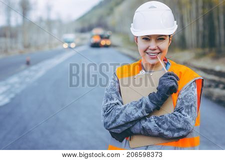 female worker road construction infrastructure repair pavement