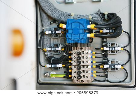 Electrical terminal in junction box and service by technician. Electrical device install in control panel for support program and control function by PLC. routine visit check equipment by technician.