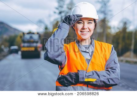 female worker road construction infrastructure repair pavement