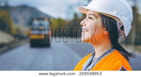 female worker road construction infrastructure repair pavement