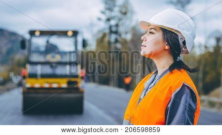female worker road construction infrastructure repair pavement