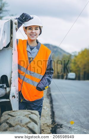 female worker road construction infrastructure repair pavement