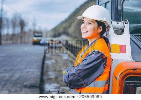 female worker road construction infrastructure repair pavement