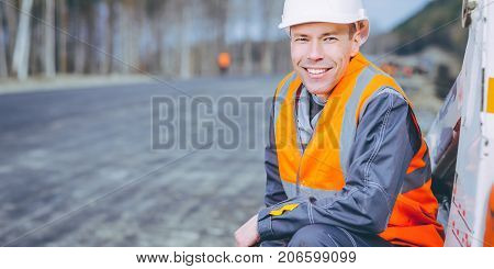 male worker road construction infrastructure repair pavement
