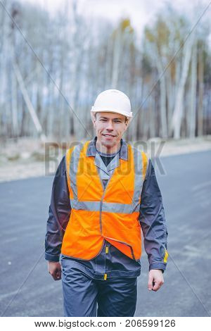 male worker road construction infrastructure repair pavement